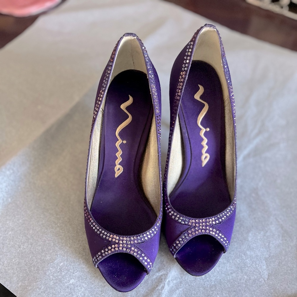 Purple with rhinestones, modest heels.